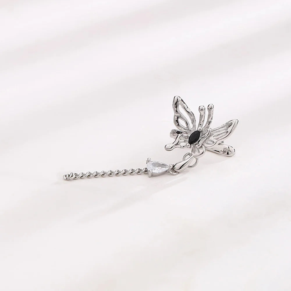 Butterfly and Crystal Cascade Ear Cuff shown at angle highlighting chain and crystal detail
