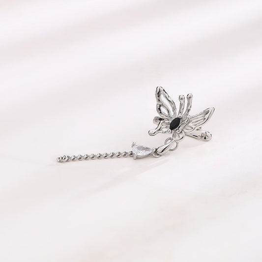 Detailed image of the Butterfly and Crystal Cascade Ear Cuff, emphasizing the luxurious white gold finish and sophisticated butterfly design.