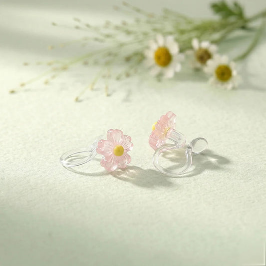 Close-up of the resin petal texture and clear stud clip mechanism for non-pierced ears.