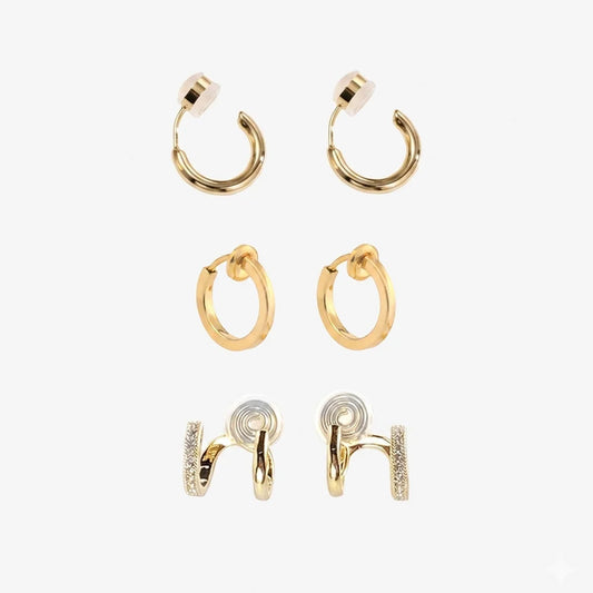 Set of 3 pairs of gold clip-on hoop earrings on a white background.