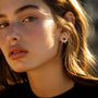 Channel your inner power with these dazzling gold sun clip-on earrings.  Set with fiery red faux rubies, these celestial-inspired earrings are perfect for adding a touch of bold style.  The secure hinged back closure ensures a comfortable fit for non-pierced ears.