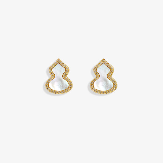 Bring on the good luck with these charming Wulu clip-on stud earrings. Featuring a petite mother-of-pearl gourd design adorned with sparkling zircons, all crafted in gleaming gold-tone alloy. The secure coil clip closure ensures a comfortable fit for non-pierced ears. A touch of ancient Chinese symbolism for everyday style.