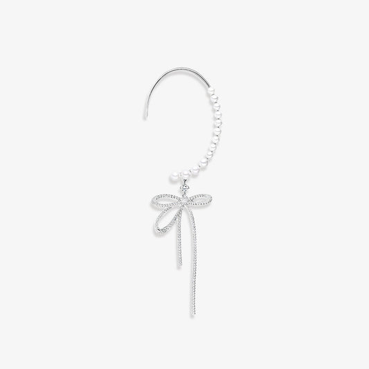 Elegant silver-tone bow and pearls ear wrap cuff earring with faux pearls and sparkling zircon accents. This classic style cuff is a sophisticated accessory for weddings and formal events, adding a touch of refined glamour without the need for pierced ears.