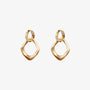 Pair of gold geometric pave drop earrings on a light gray background