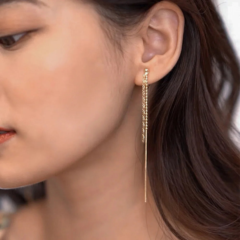 Silver chain chandelier clip-on earrings side view on model with dark hair