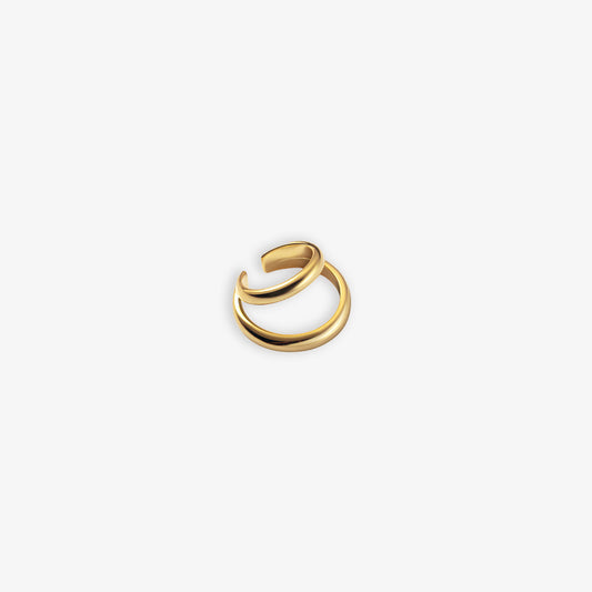 Close-up view of a gold Dual Loop Conch Ear Cuff against a white background. Its S925 Silver body and luxurious gold finish make it a sophisticated accessory for professional settings or a subtle yet stylish addition to workwear.