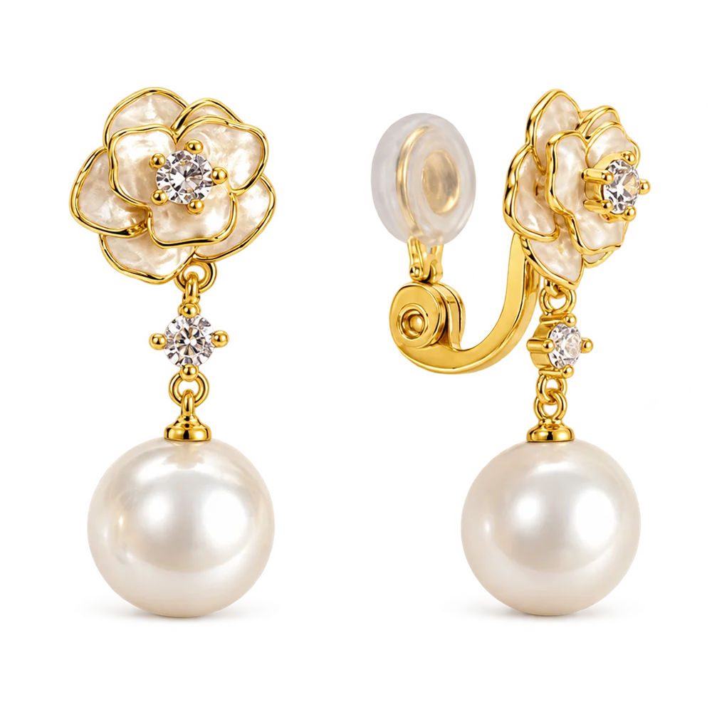A pair of gold and pearl flower-shaped drop earrings with clear gemstone centers, shown on a clean white background. One earring is facing forward to show the flower and dangling pearl, while the other is angled to show the clip-back closure.