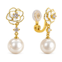 A pair of gold and pearl flower-shaped drop earrings with clear gemstone centers, shown on a clean white background. One earring is facing forward to show the flower and dangling pearl, while the other is angled to show the clip-back closure.