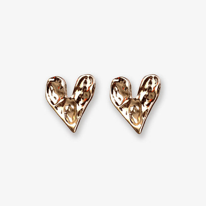 Elegant gold-finished heart clip-on earrings, combining classic charm with a modern twist. The hinged-back closure ensures a secure and comfortable fit, ideal for adding a touch of timeless romance to any ensemble.