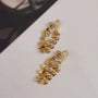 A detailed photo showing the gold honeycomb dangle earrings with an alternative adjustable u-type clip-on finding.