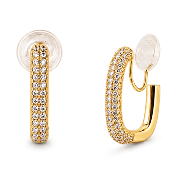 A pair of gold huggie hoop earrings adorned with pavé-set clear cubic zirconia stones, featuring a clear textured silicone ear plug, shown on a solid white background.