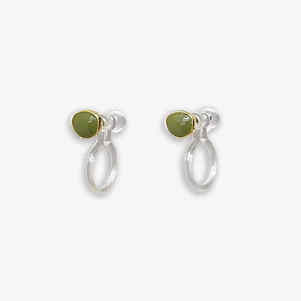 These Green Pea Clip-on Stud Earrings are as comfortable as they are charming. Crafted from lightweight resin, they're fashioned to resemble delightful green peas, adding a whimsical yet minimalist touch to your look. The invisible clip-on design ensures a secure fit without pinching, perfect for long-lasting comfort throughout the day.