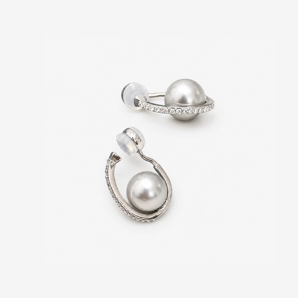 Close up of the cushioned clip on closure on a silver grey pearl hoop earring