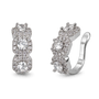 A pair of silver huggie hoop earrings with three stacked oval-cut clear gemstones, each surrounded by a halo of smaller clear stones, shown on a plain white background.