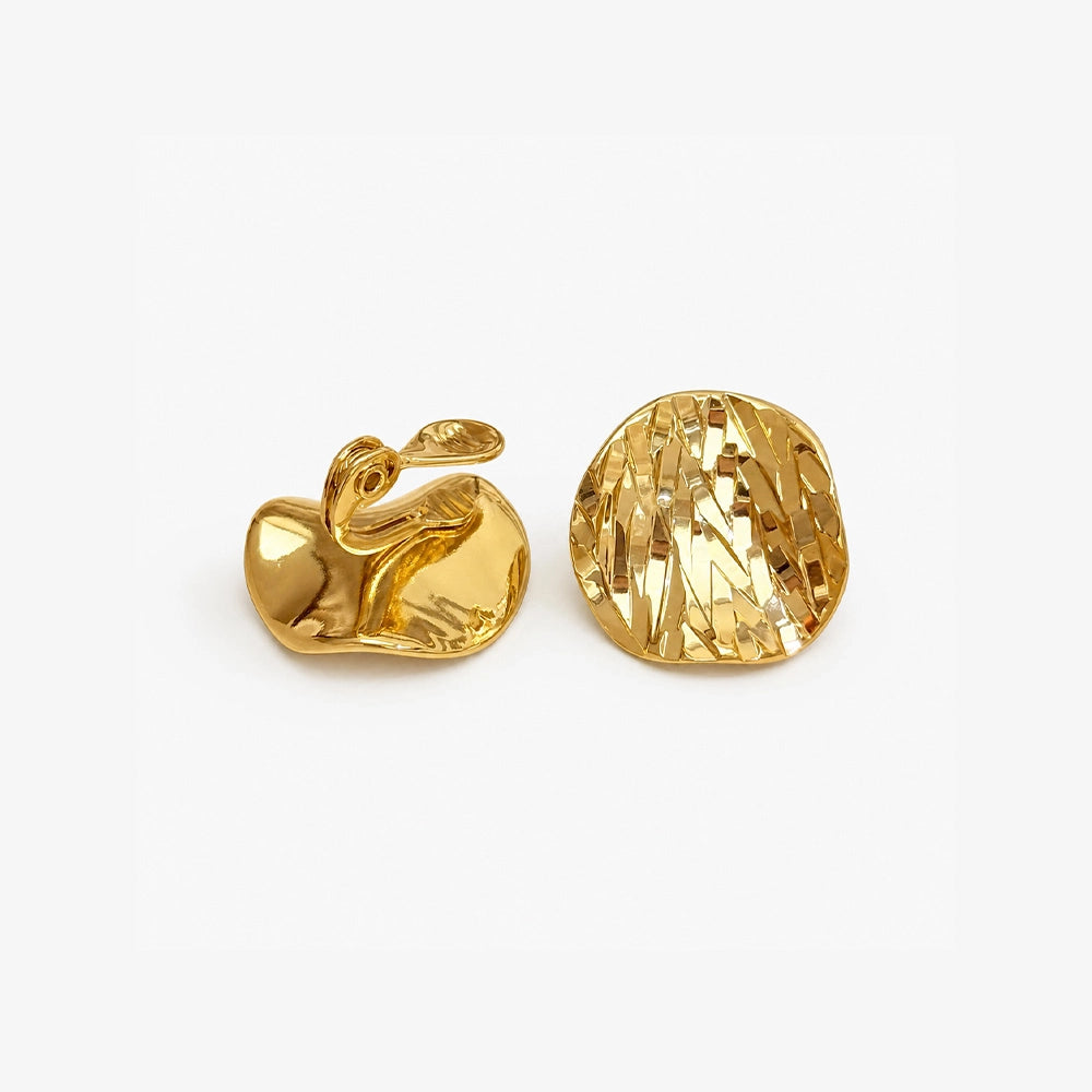 Hammered gold disc clip on earrings showing the adjustable clip on closure