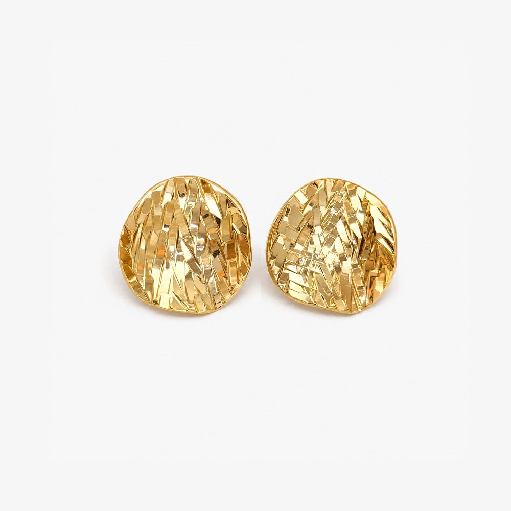 Pair of hammered gold disc clip on earrings with a domed textured finish