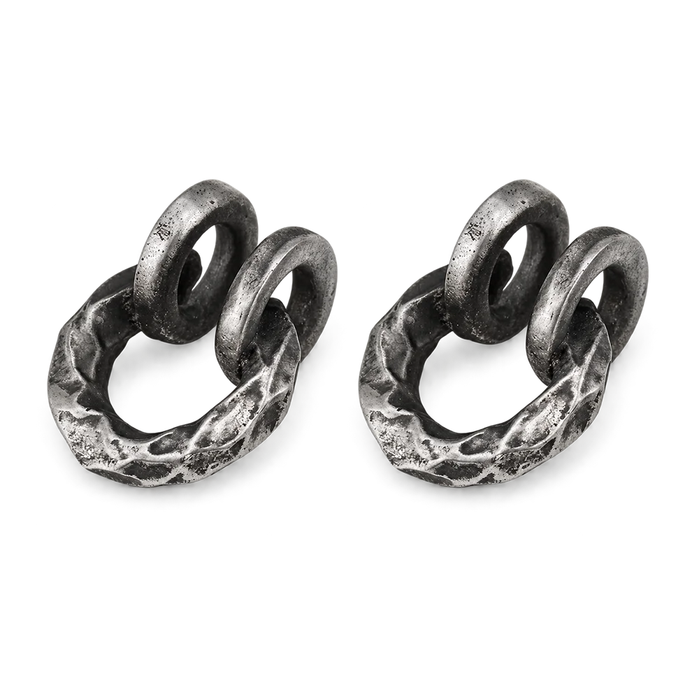 A pair of oxidized silver double-loop ring earrings with a hammered, textured finish, displayed on a clean white background.