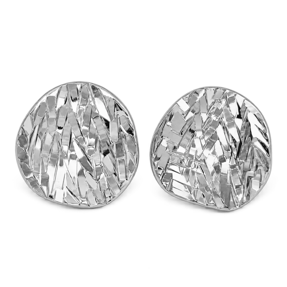 A pair of silver statement earrings with a textured, faceted chevron pattern, shown on a plain white background.