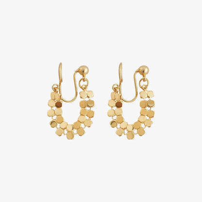 A pair of gold honeycomb mesh clip-on hoop earrings in a U-shape design, shown on a clean white background.