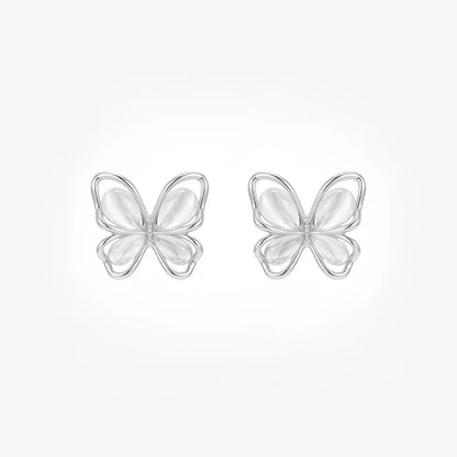 A pair of iridescent silver butterfly stud earrings with white cat's eye wings shown from the front on a white background.
