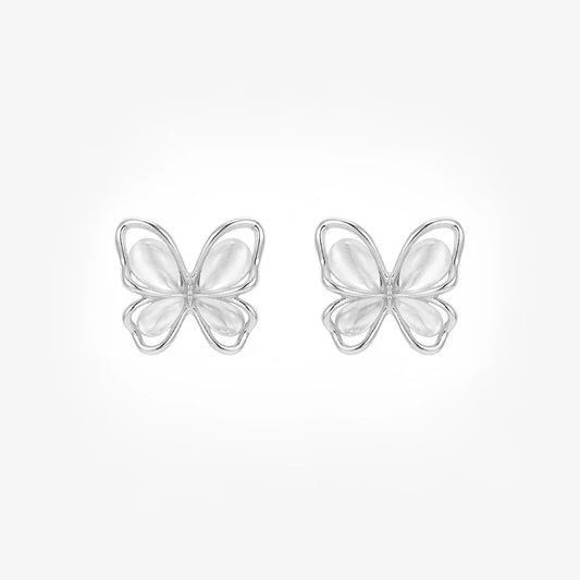 A pair of iridescent silver butterfly stud earrings with white cat's eye wings shown from the front on a white background.