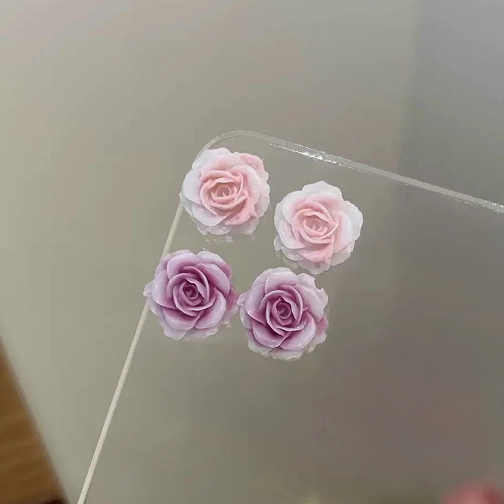 close up view of lavender rose and pink rose magnetic clip‐on stud earring