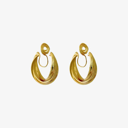 A pair of layered gold wave clip-on hoop earrings with a mosquito coil back, shown isolated on a clean white background.