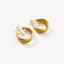 A pair of layered wave gold clip-on hoop earrings with an invisible resin clip, displayed on a white background