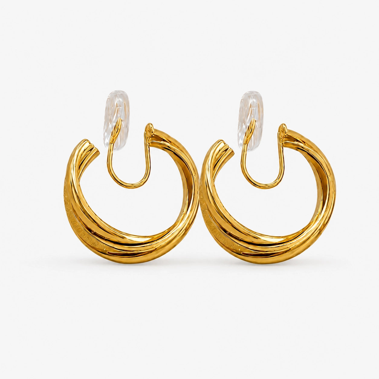 A pair of layered gold wave clip-on hoop earrings with a mosquito coil back, shown isolated on a clean white background.