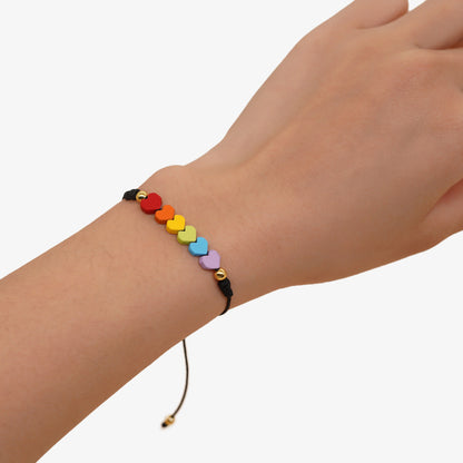 Lesbian or bisexual pride bracelet featuring rainbow heart stones, adjustable for any wrist size.