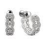 A pair of silver huggie hoop earrings adorned with multiple round-cut and pavé-set clear stones, shown from both the front and side angles on a white background.