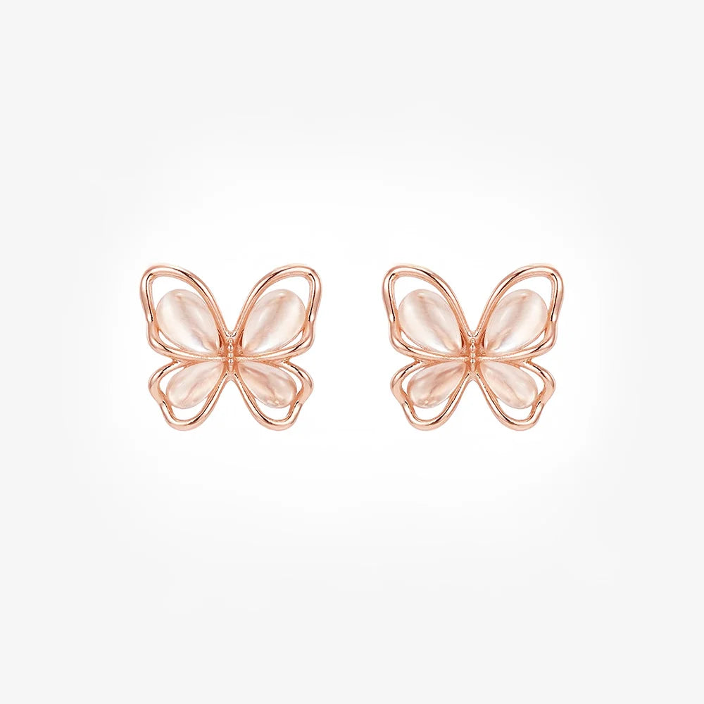 Front view of a pair of rose gold butterfly magnetic stud earrings with soft pink cat's eye wings on a white background.