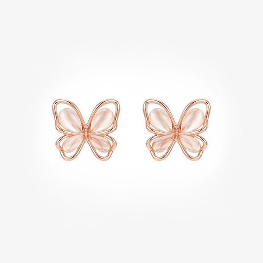 Front view of a pair of rose gold butterfly magnetic stud earrings with soft pink cat's eye wings on a white background.