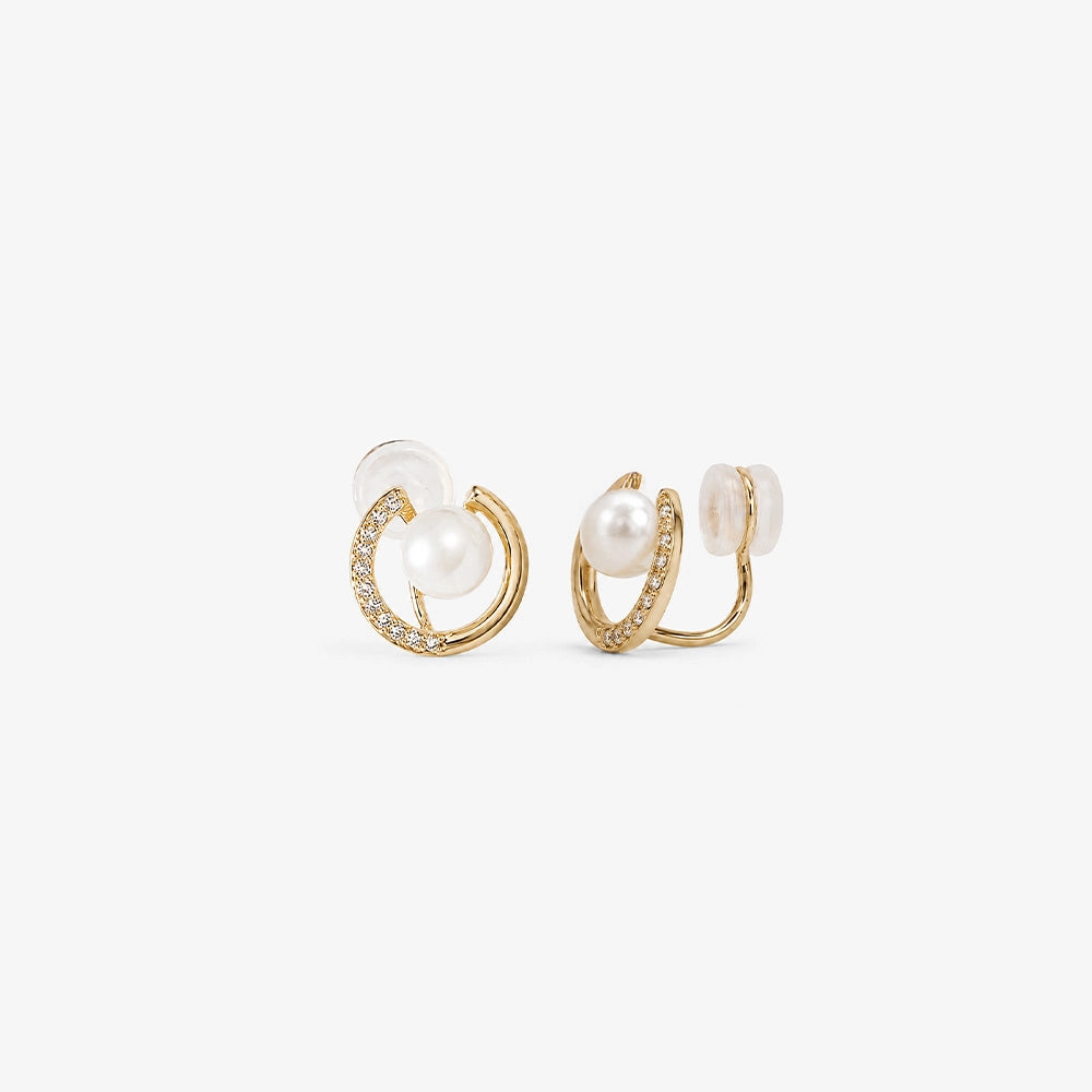 Front and side profile of pearl crescent moon clip on earrings on a clean white background.