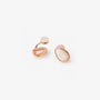 Close-up of the teardrop mother of pearl clip-on earring from behind, highlighting the rose gold metal loop and the comfortable spherical non-piercing closure pad.