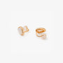 Close-up of the teardrop mother of pearl clip-on earring from behind, highlighting the rose gold metal loop and the comfortable spherical non-piercing closure pad.