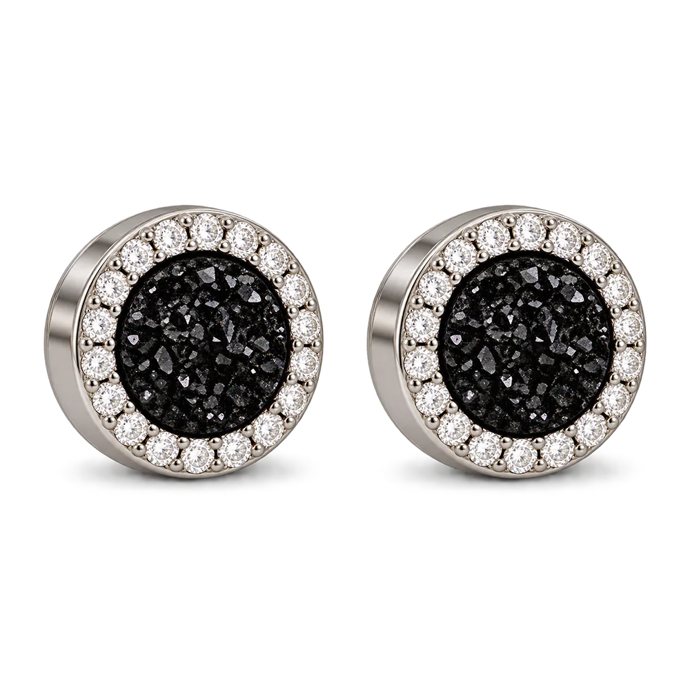 A pair of round stud earrings featuring textured black druzy centers surrounded by a halo of small clear stones in a silver-toned setting, shown on a plain white background.