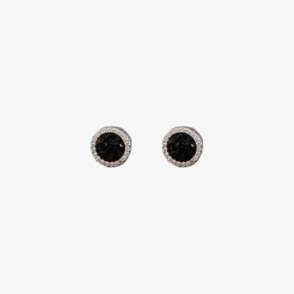A pair of no-piercing black crystal magnetic stud earrings, highlighting their brilliant black center and pavé halo, isolated on a white background.