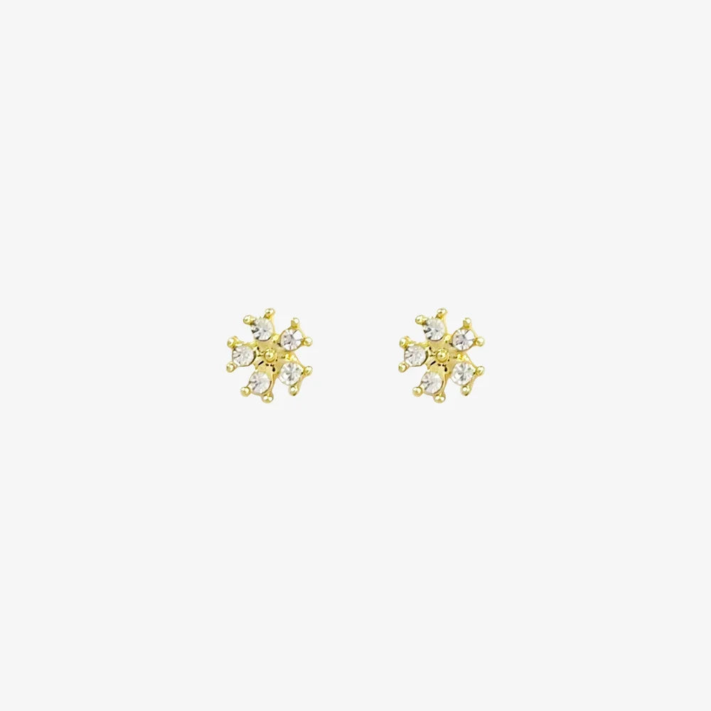 A pair of no-piercing Golden Snowflake Crystal invisible clip-on earrings, with their radiant gold-tone and clear cubic zirconia, isolated on a white background.