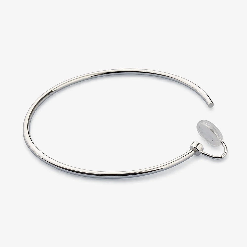 Single large silver-tone hoop clip-on earring showing the U-Type clip and resin pad