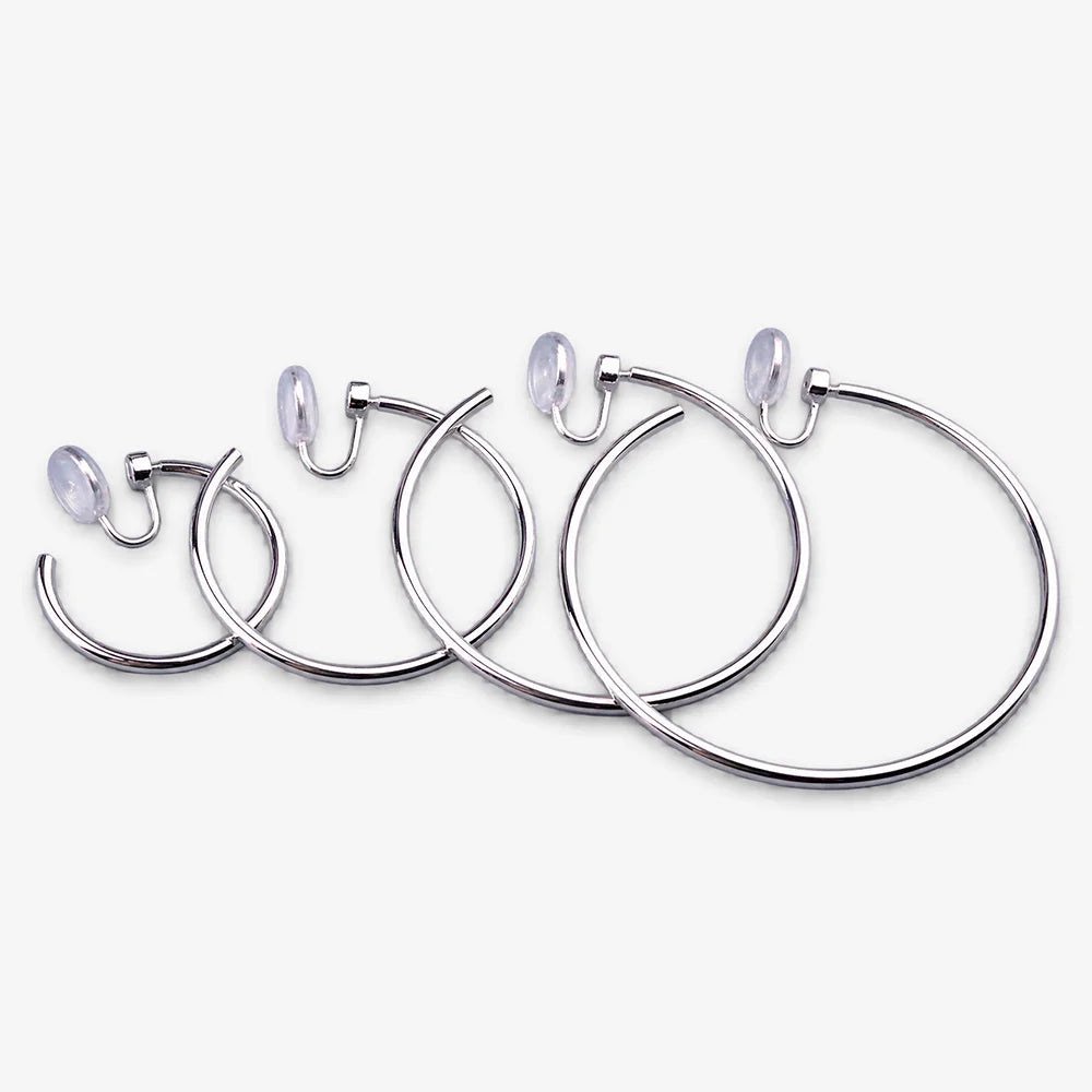 Silver-tone hoop clip-on earrings in a range of sizes lined up from smallest to largest