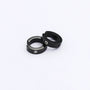 A pair of black spring-loaded clip-on hoop earrings with a subtle zircon accent, styled together on a clean white background.