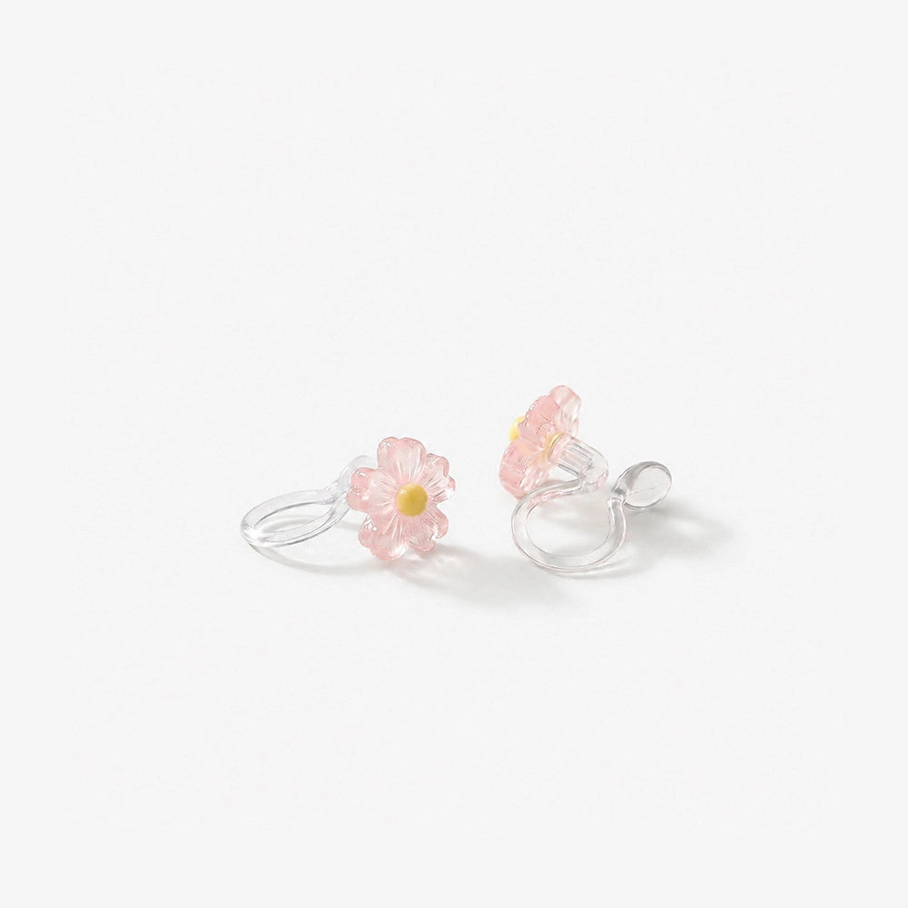 Close-up of the resin petal texture and clear stud clip mechanism for non-pierced ears.