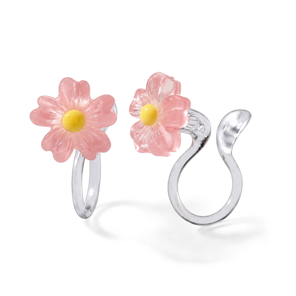 A pair of pink daisy flower earrings with a candy color translucent finish and stud clip-on backs.