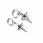 Pair of polaris star clip-on earrings on a white surface, one showing the front view with a green gem and the other showing the back view of the green gem version.