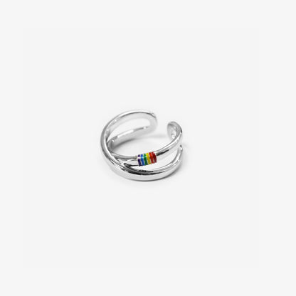 Bold statement ring with a colorful rainbow band, celebrating love and pride for lgbt.