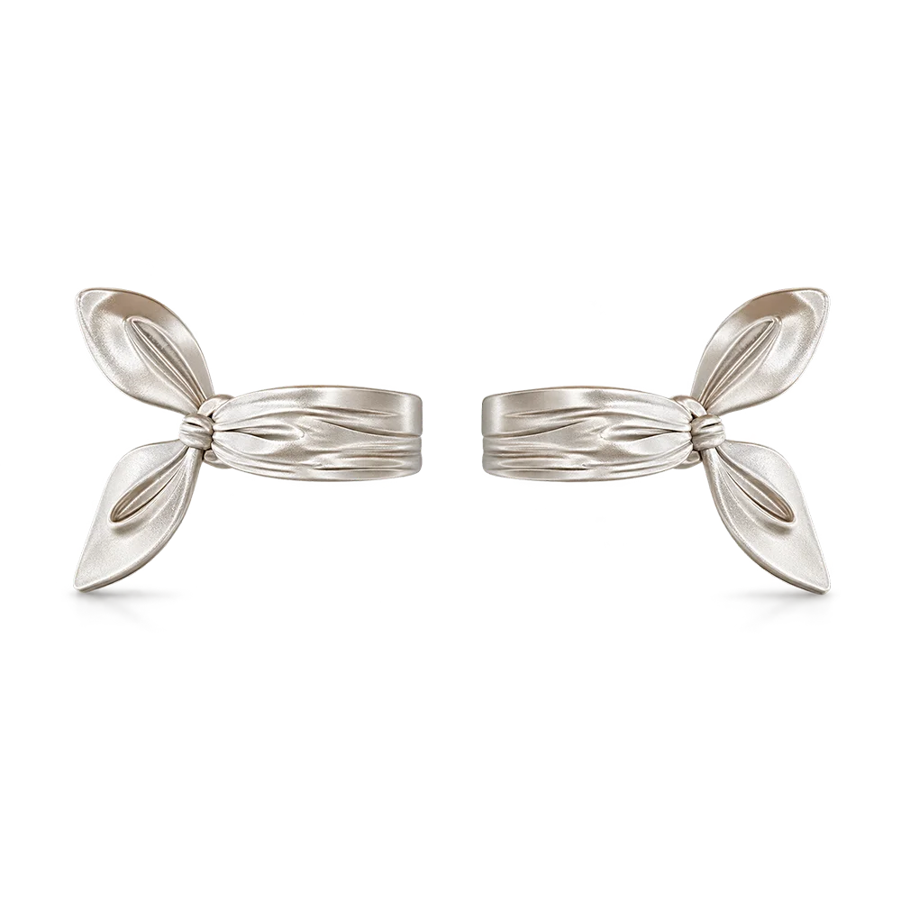 A pair of silver-toned butterfly-shaped clip-on earrings with a polished metallic finish, displayed on a clean white background.