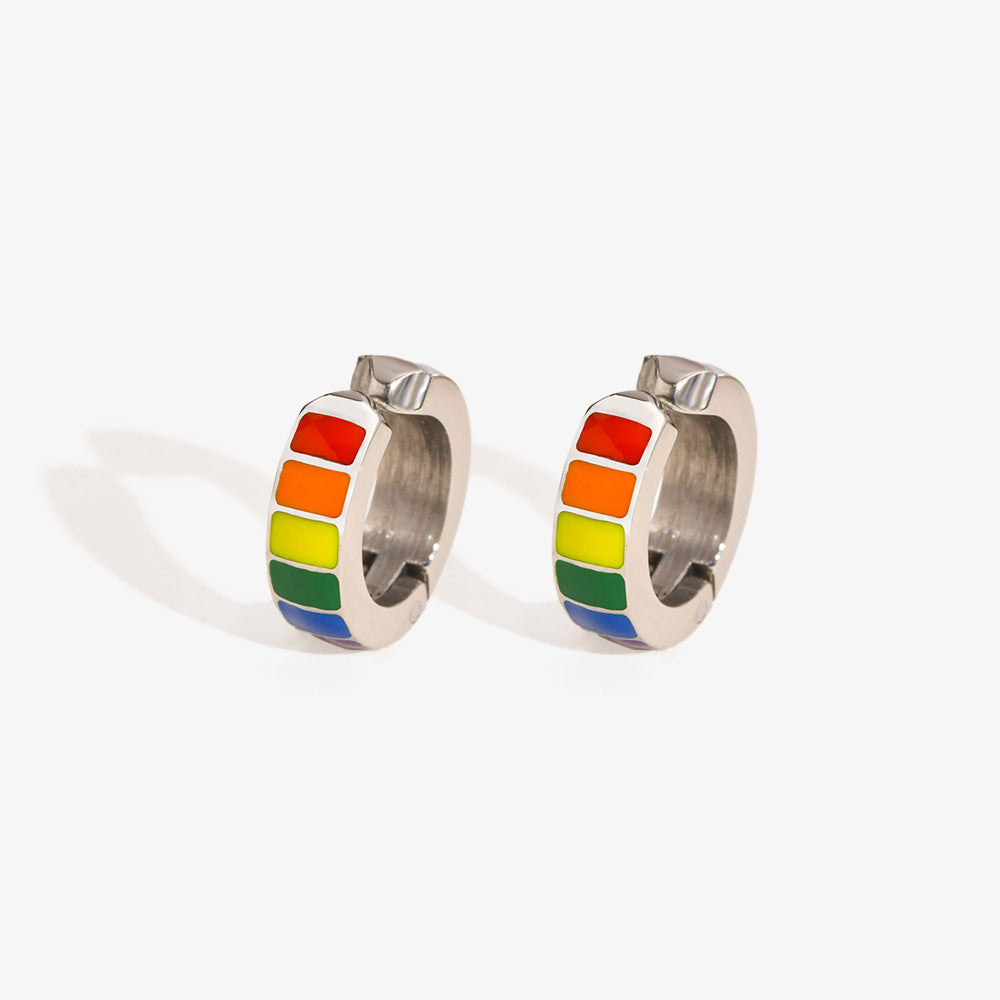 Silver huggie hoop earrings featuring a vibrant rainbow pattern, symbolizing pride and inclusion. Perfect for expressing support for the lesbian and gay community. 