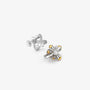 Pair of silver and gold stud earrings on a white background