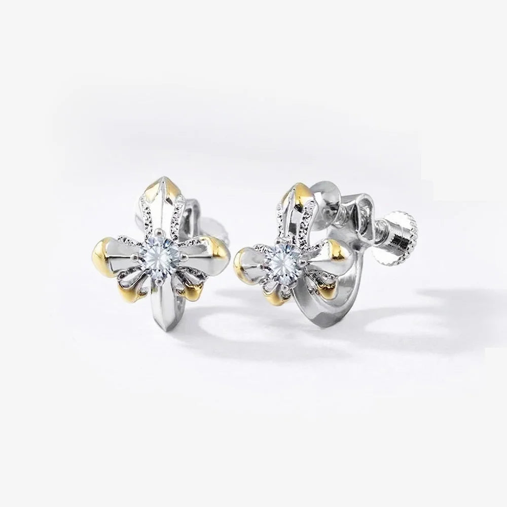 Front and back view of the Regal Two-Tone Cross Clip On Earrings, highlighting the adjustable screw-back closure and polished mixed metal finish.